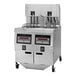 A large Henny Penny electric fryer with three containers and controls.