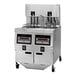 A Henny Penny natural gas fryer with three containers and controls.