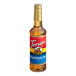 A Torani Pumpkin Pie flavoring syrup 750 mL plastic bottle with a red label.