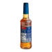 A Torani Sugar-Free Salted Caramel flavoring syrup plastic bottle with a blue label.