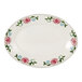 A white Tuxton oval china platter with pink flowers on it.