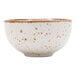 A white bowl with brown speckles on it.