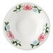 A Tuxton China narrow rim bowl with pink flowers on it.