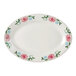 A white Tuxton china oval platter with pink flowers on it.