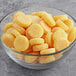 A bowl of Vidal Sour Gummy Pineapple and Orange Bites.