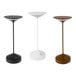 Three white Abert Tempo rechargeable table lamps on a table.