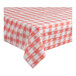 A red and white checkered Table Mate plastic tablecloth on a table.