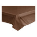 A brown Table Mate plastic table cover roll on a table.