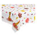 A white tablecloth with fall leaves and pumpkins on it.