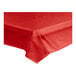 A red plastic Table Mate table cover on a table.