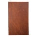 A close-up of a brown leather H. Risch, Inc. customizable menu cover.