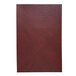 A brown leather menu cover with a red leather piece of paper on the front.
