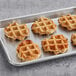 A tray of Vafels Vegan Original Liege Waffles on a metal surface.