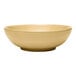 A close up of a Libbey tan terracotta stoneware bowl on a white background.