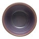 A purple stoneware bowl with a brown rim.