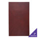 A red leather H. Risch, Inc. menu cover with white text on a red surface.