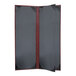 A grey board with a red border and black and red folding menu cover with a black cover.