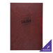 A brown leather H. Risch, Inc. menu cover on a table in a bar.