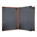 A black menu cover with a brown wooden frame.