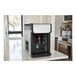 An Aquverse A2500-K hot and cold water dispenser on a counter.
