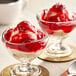 Two desserts in glass dishes with Creamery Ave. Premium Strawberry Dessert on top.