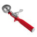 A red and silver Fourté thumb press ice cream scoop.