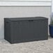 A Suncast black plastic outdoor storage box.