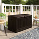 A brown Suncast resin deck box on a deck.