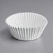 A white paper Enjay cupcake liner.