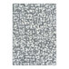 A close-up of a Joy Carpets grey and white area rug with abstract designs.