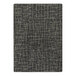 A close-up of a black and white patterned Joy Carpets area rug.