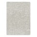 A close-up of a beige rectangle area rug with a pattern on it.