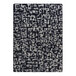 A black and white Joy Carpets area rug with abstract designs.