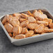 A tray of Tindle plant-based vegan chicken wings on a table.