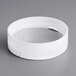 A white circular object with a clear surface.