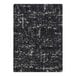 A close-up of a black and white Joy Carpets WorkSpace area rug with a distressed look.