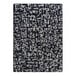 A Joy Carpets onyx rectangle area rug with abstract black and white designs.