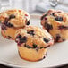 Blueberry muffins made in a Pavoni Formaflex silicone baking mold on a plate.