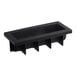 A black silicone baking mold with four Yule log compartments.