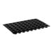A black silicone Pavoni mini muffin pan with 54 small holes.