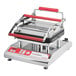 A Pavoni Cookmatic tartlet press with red handles and black and red trim.