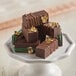 A stack of chocolates made with Pavoni rectangle silicone mold with gold foil on top.