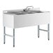 A Regency stainless steel underbar sink with three bowls and a left drainboard.