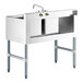 A Regency stainless steel underbar sink with left drainboard, faucet, and two bowls.