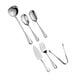 A close-up of Acopa stainless steel serving utensils including a spoon, fork, and knife.