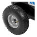 A close-up of a black and white tire on a white rim.