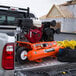 An Industrial Air Contractor wheelbarrow air compressor in the bed of a truck.