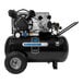 An Industrial Air portable horizontal air compressor with black and silver wheels.