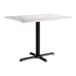 A white rectangular Lancaster Table & Seating table with a black base.