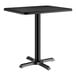 A black rectangular Lancaster Table & Seating table with a metal base.